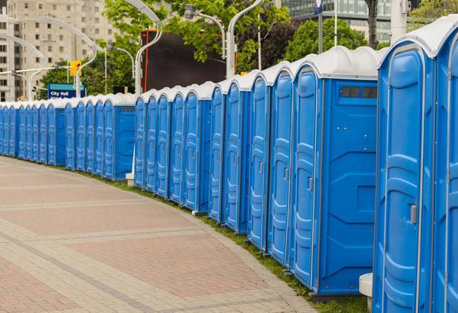 a fleet of portable restrooms ready for use at a large outdoor wedding or celebration in Aventura